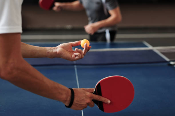 Advanced player serving during a competitive Dulwich TTC training session